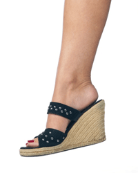 Wedge sandals are still hip, though studded black leather is not usually seen as cutting-edge fashion.