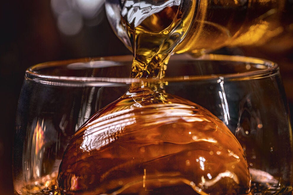 Pouring whiskey into a glass