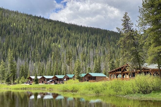 The tents and cabins at Piney River Ranch are steps from the lake