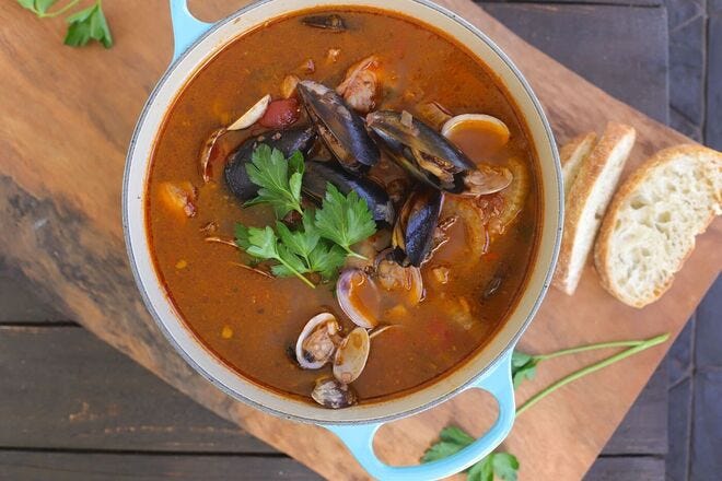 Dive into a bowl of mussels, clams, fish, and shrimp in a rich broth for an easy summer meal